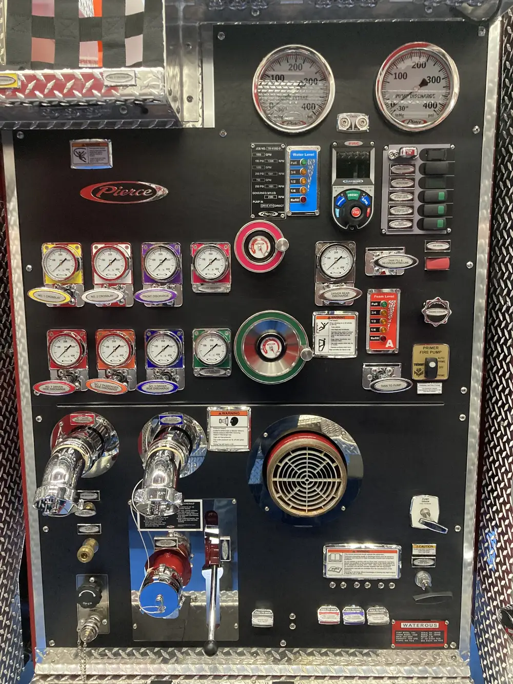 Pump panel close-up showing gauge cluster and intake controls