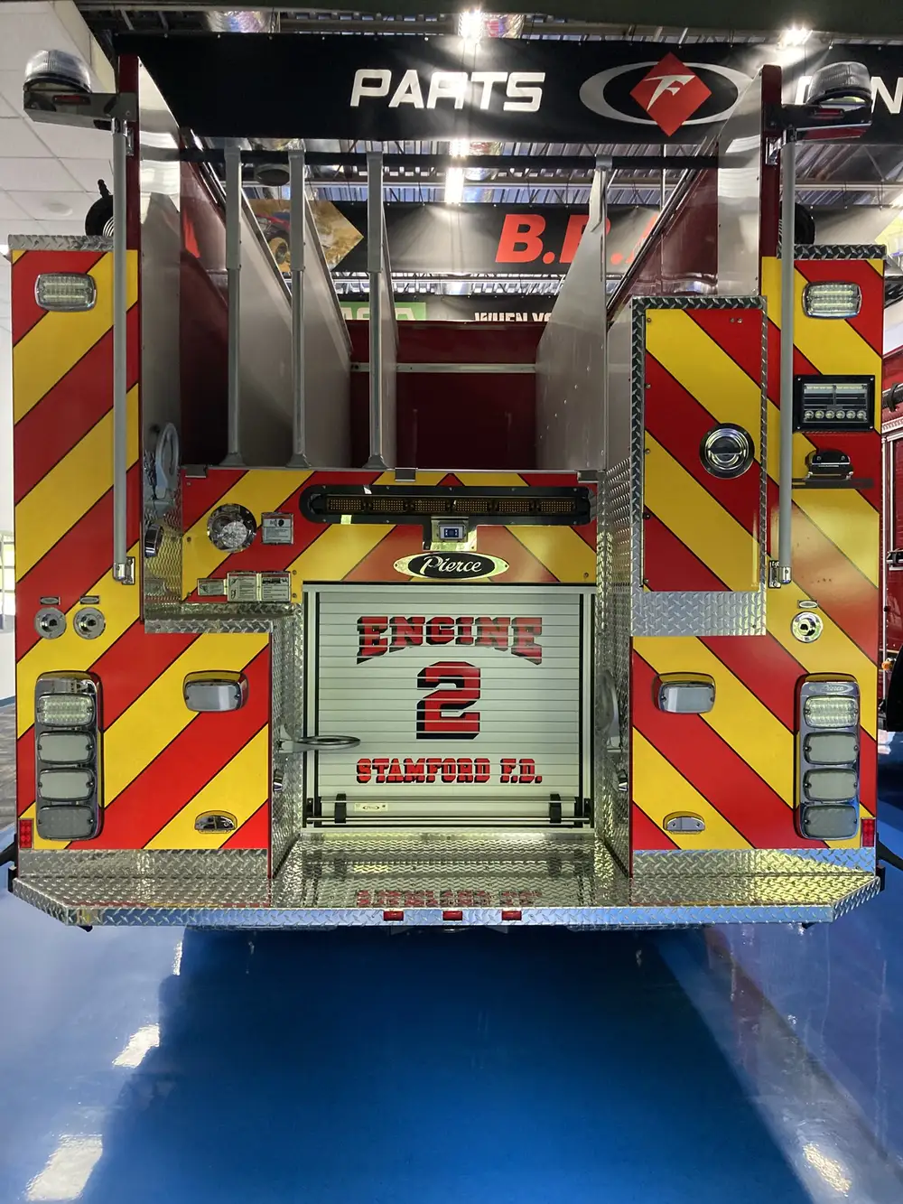 Rear view showing red-and-yellow chevrons and centered unit panel