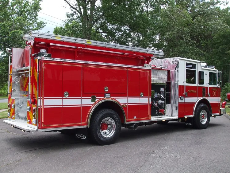 Rear-right exterior view showing side hosebed rails and rear body panel