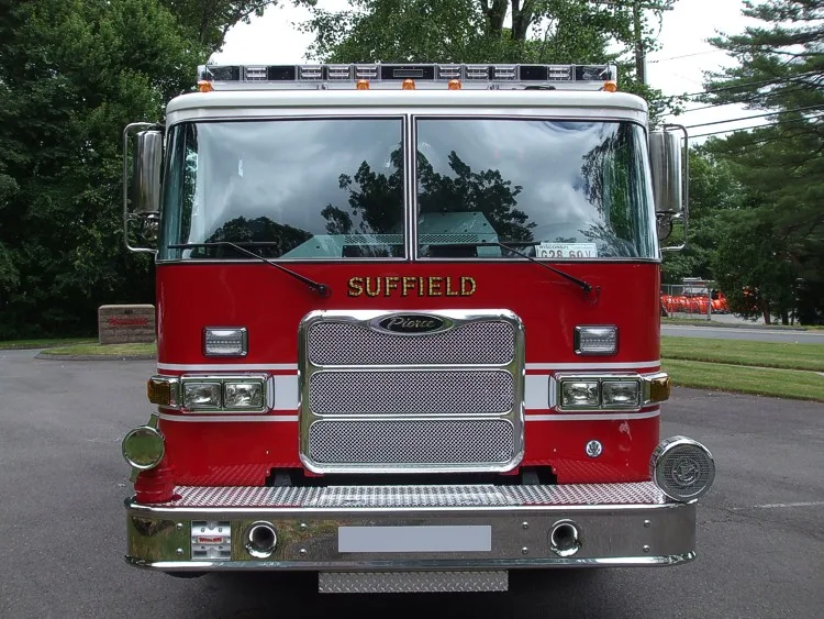 Front exterior view showing grille, bumper, and warning lights