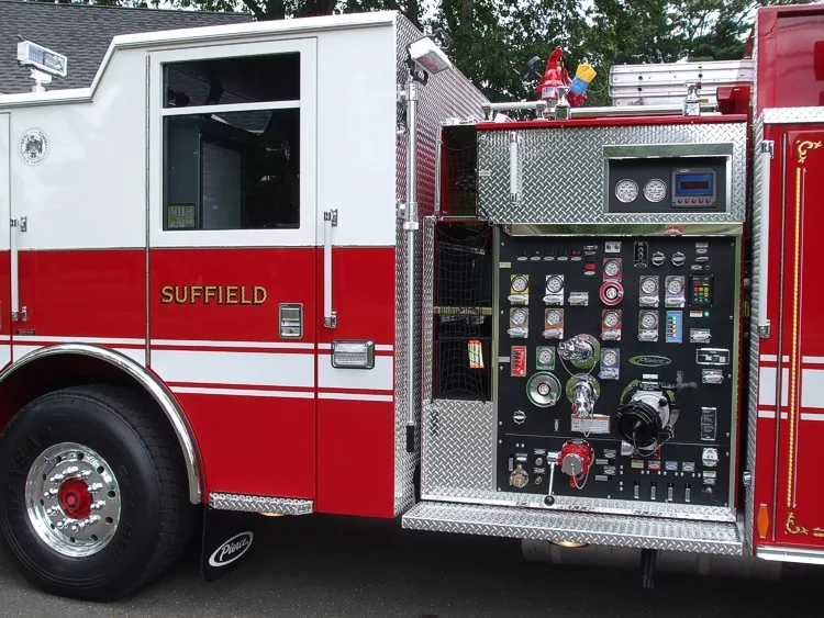 Pump panel close-up showing gauges, valves, and intake controls