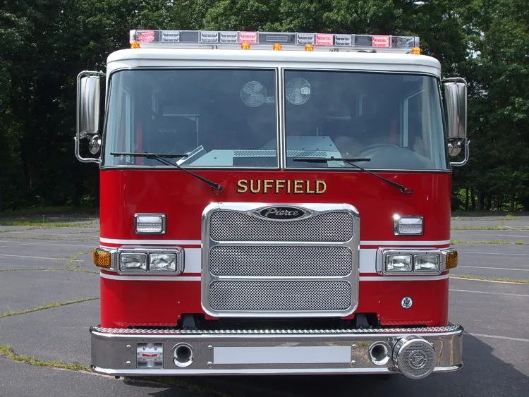 Head-on front view showing grille, bumper, and roof warning light bar