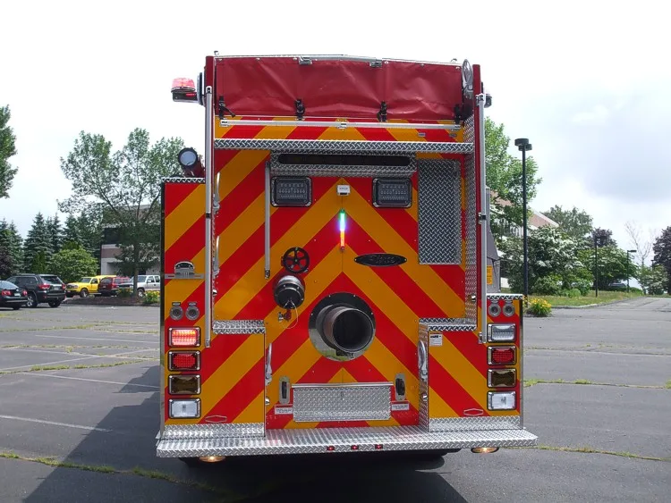 Direct rear view showing red-yellow chevrons and large rear discharge outlet