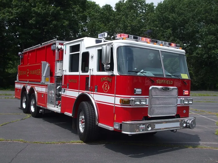 Front-right exterior view showing chrome bumper, grille, and cab door emblems