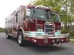Rescue truck front-left exterior view showing enclosed cab and long body