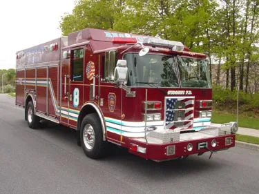 Front-right exterior view showing long rescue body and side compartments