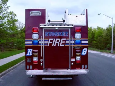 Rear view showing rear door panel, warning lights, and side rails