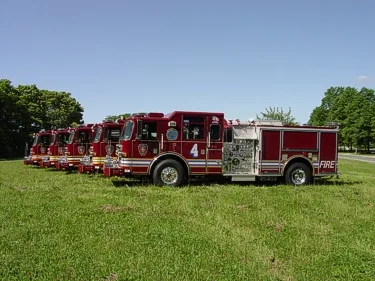 Wide lineup side view showing multiple pumpers parked in a row
