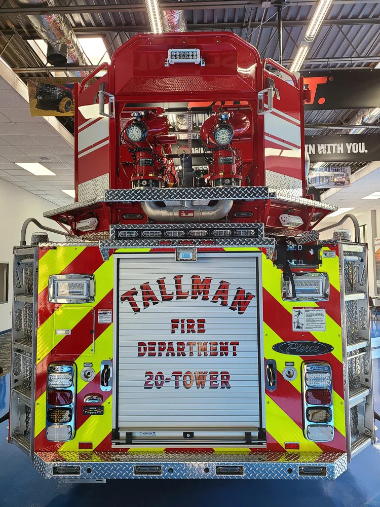 Rear view showing red-and-yellow chevrons and centered rear panel
