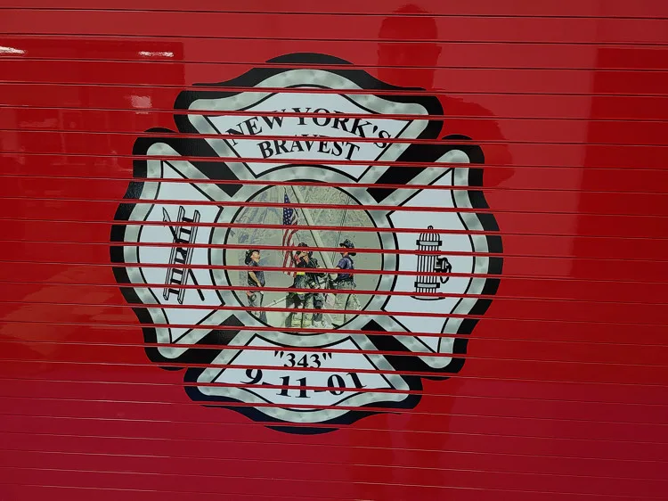Roll-up door close-up showing white department crest graphic