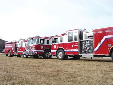 Lineup side view of multiple pumpers showing driver-side profiles and pump panel areas