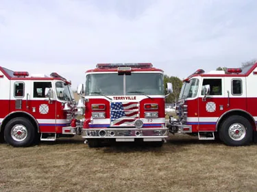 Close lineup view showing front ends, side mirrors, and cab doors