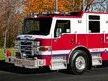 Terryville fire engine driver-side profile showing pump panel and body compartments