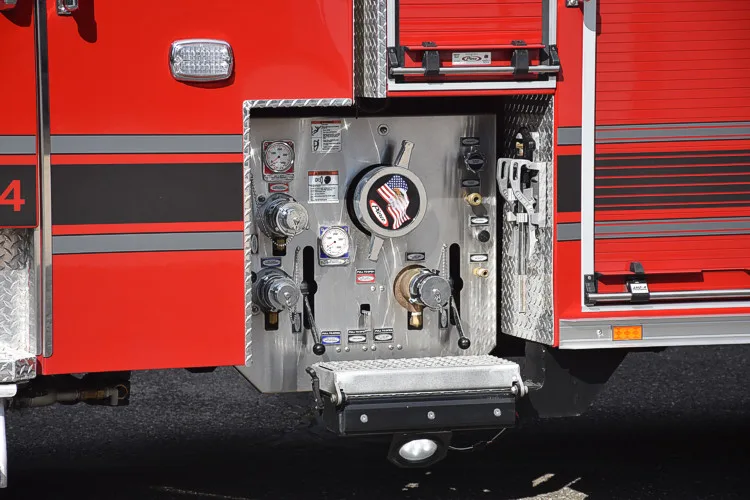 Pump-side control panel close-up showing gauges and valve handles