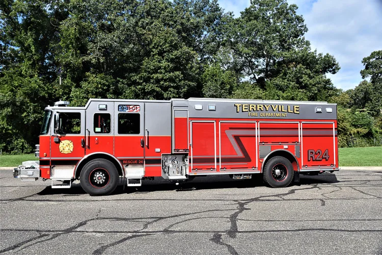 Driver-side profile showing pumper body and rear wheel area