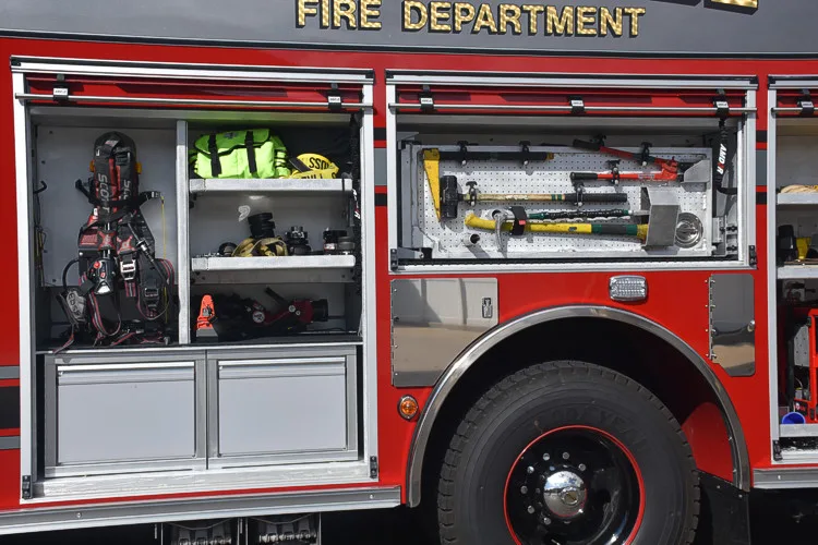 Open side compartment showing mounted tools and SCBA packs