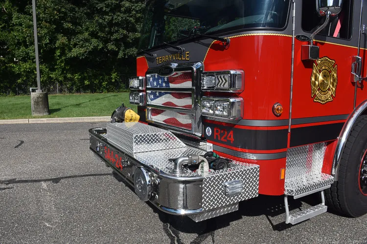 Front bumper close-up showing grille bars and warning lights
