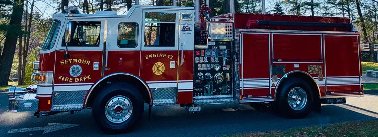 Driver-side profile strip view showing full pumper body