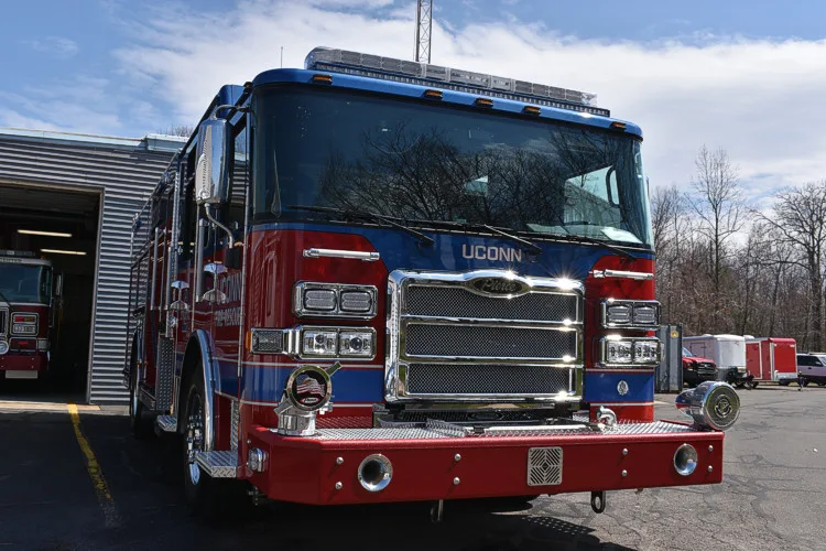 Pumper front-left exterior view with grille, cab, and side body visible