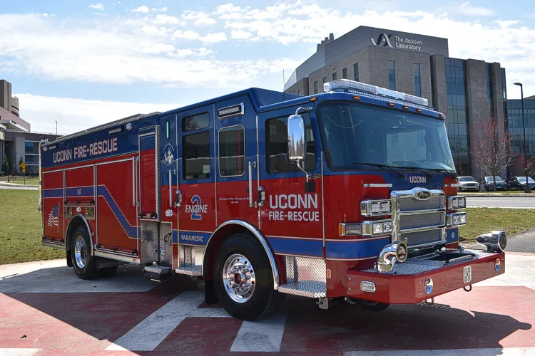 Driver-side profile view showing pumper body and wheelbase