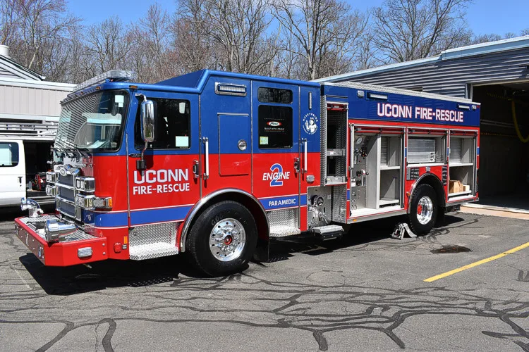 Driver-side profile view showing side compartments and rear body section