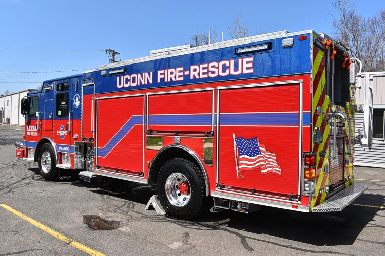 Rear-left exterior view showing pumper body and side compartments