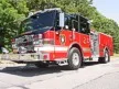 Wide front-left thumbnail view of the pumper parked roadside with full side body visible.
