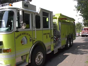 Driver-side cab view showing front door, side window, and wheel area