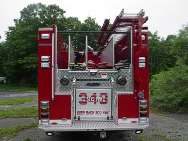 Rear view showing rear panel, warning lights, and hosebed divider fins