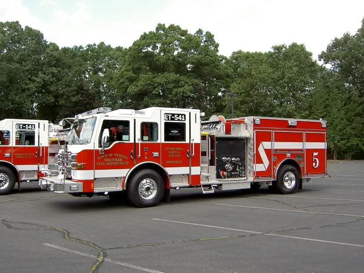 Wide side lineup view showing apparatus parked across lot