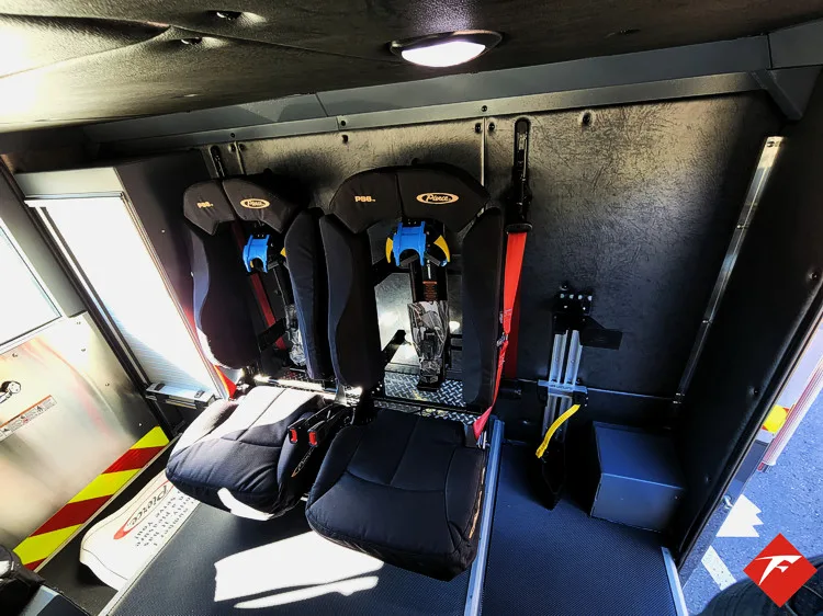 Cab interior side view showing rear seat area and side window