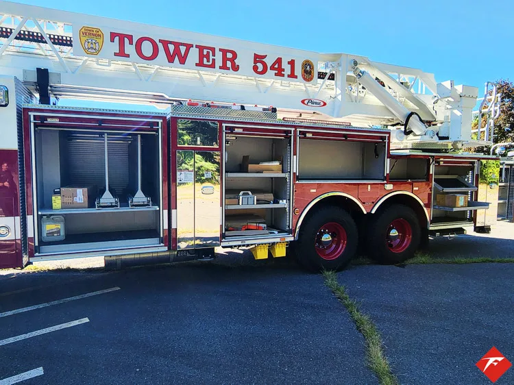 Driver-side profile with open compartments showing large storage bays