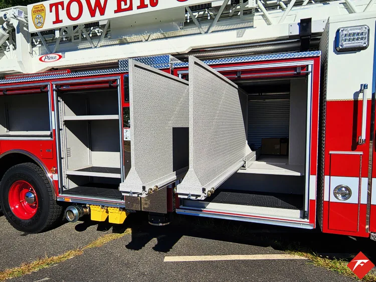 Open mid-body compartment showing pull-out tray and empty shelf storage