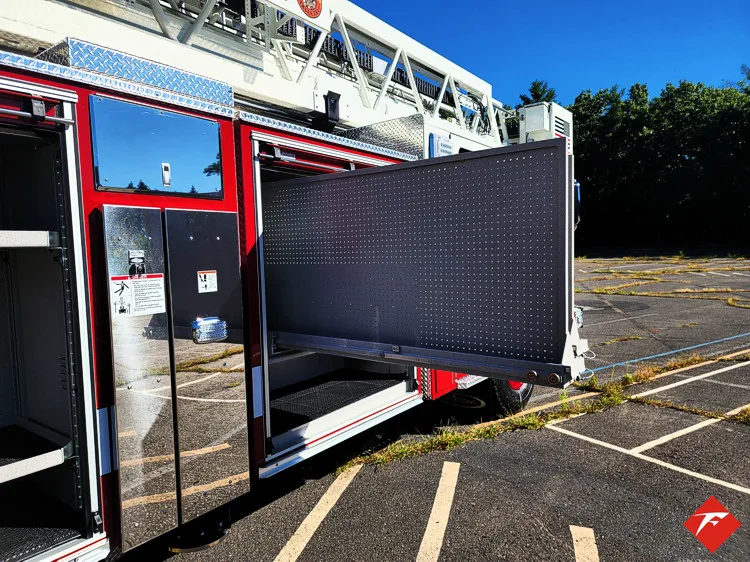 Open side compartment with large slide-out tray extended from body