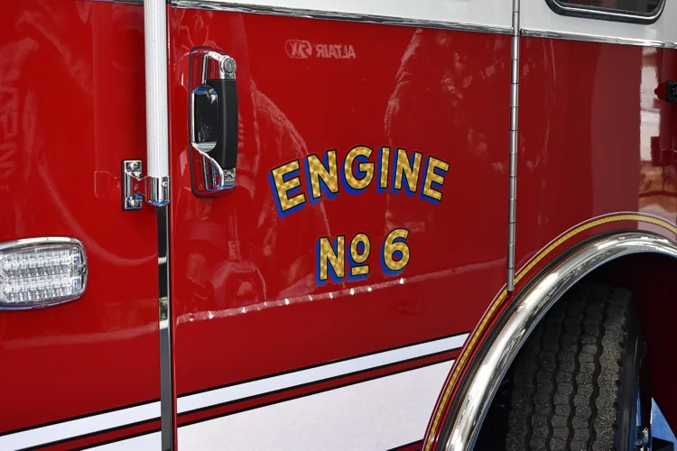 Cab-side lettering close-up showing unit designation on red panel