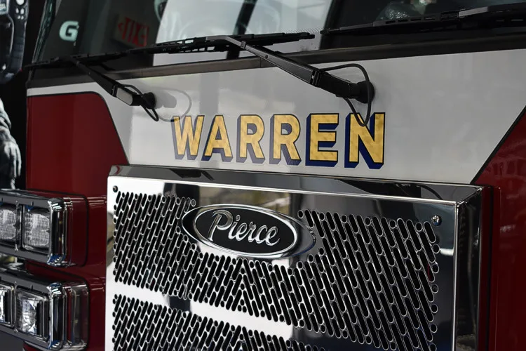 Front grille close-up showing Pierce badge and raised lettering