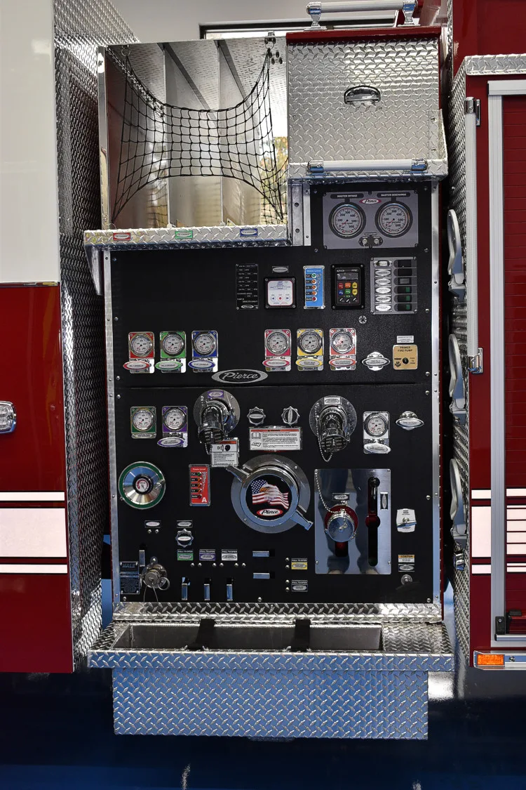 Pump panel close-up showing gauges, valves, and intake controls