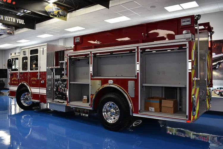 Driver-side profile with open compartments showing side storage bays