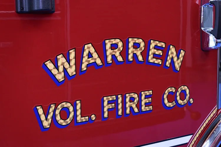 Cab-side lettering close-up on red door panel