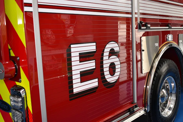 Body side close-up showing large unit number near rear wheel