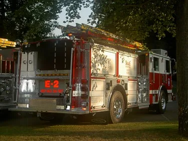 Rear-right exterior view showing rear body compartments and hosebed area