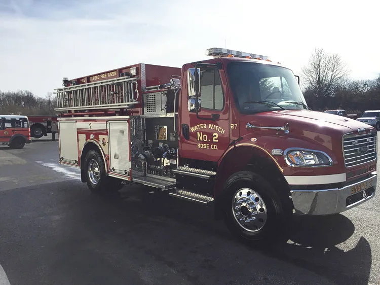 Rear view indoors showing chevron striping and upper hosebed area