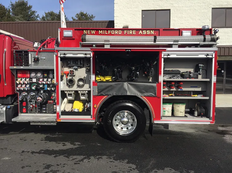 Front bumper close-up showing intake ports, lights, and treadplate step