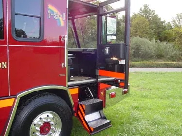 Open rear cab door view showing entry steps and crew cab interior