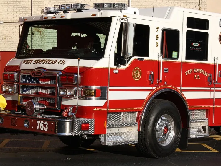 Front-left exterior close-up showing cab corner and grille detail