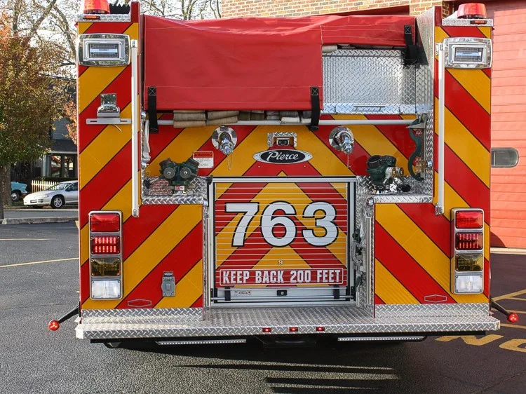 Rear view showing red-and-yellow chevrons and centered rear panel