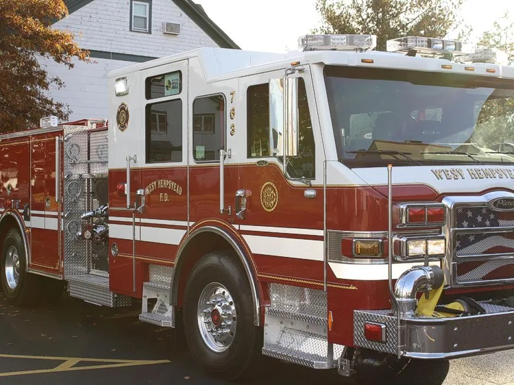 Front-left exterior view showing side body and wheelbase