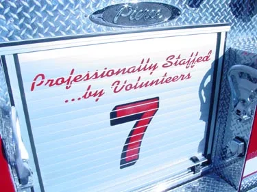 Compartment-door close-up showing scripted text and number panel