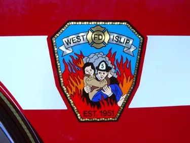 Shield logo close-up on red and white side panel