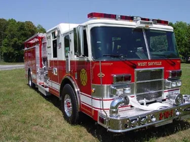 Front-right exterior view showing grille, bumper, and side body